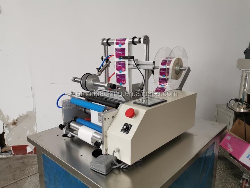 Ημιαυτόματη μηχανή ετικετοποίησης στρογγυλών φιαλών γυαλιού 10ml με αυτοκόλλητες ετικέτες μονής/διπλής όψης